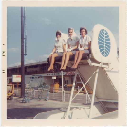 1969 March Susanne Malm & colleagues sitting on passenger stairs at either Kingston or Montego Bay, Jamaica.